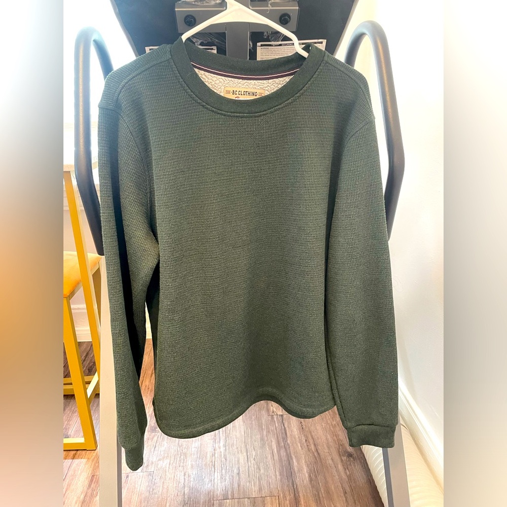 Thick, warm, long sleeved sherpa lined crewneck sweater, size M.